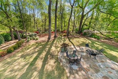 View of yard with a patio area and an outdoor fire