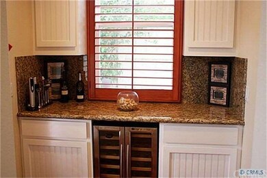 Butler's pantry with wine fridge makes entertainin