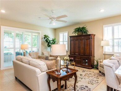 LIVING ROOM WITH PLANTATION SHUTTERS THRU OUT