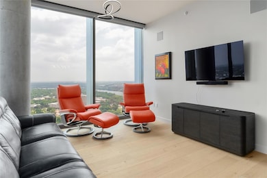 Living area featuring baseboards, expansive windo