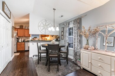 Dining area featuring dark hardwood / wood-style f