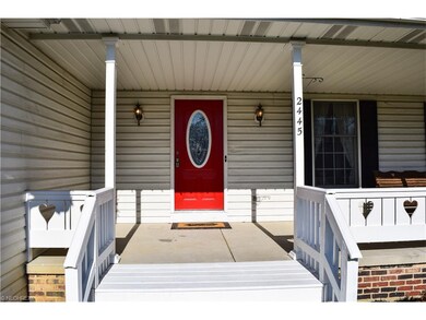 FRONT ENTRANCE 2. FRESHLY PAINTED STOOP & SURROUND