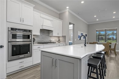 You'll enjoy plenty of room for entertaining guests with an oversized kitchen island, a kitchen cafe area, and an additional dining space.