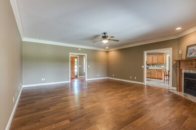 This is a view of the Great Room showing the foyer entrance and the kitchen area.