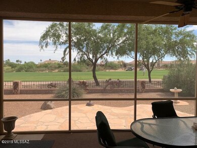 Screened-in patio overlooks fairway