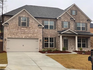 Craftsman house with concrete driveway, a shingled