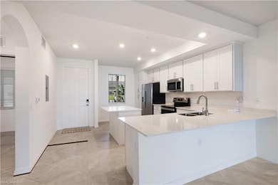Kitchen with appliances with stainless steel finis