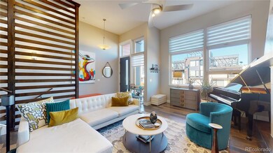 Open Living room with soaring fireplace back drop 