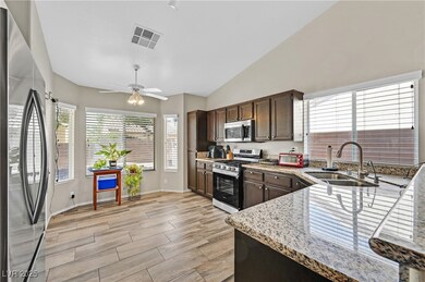 Kitchen with appliances with stainless steel finis