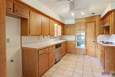 Kitchen featuring a gas cooktop and large pantry, 
