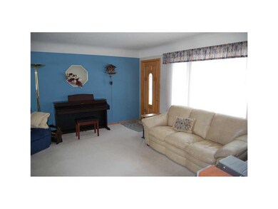 Living Room. All window treatments stay.