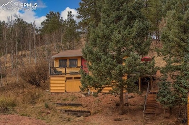 View of front of home featuring stairway, log vene