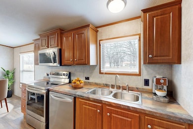 Kitchen with sink, stainless steel appliances, cro