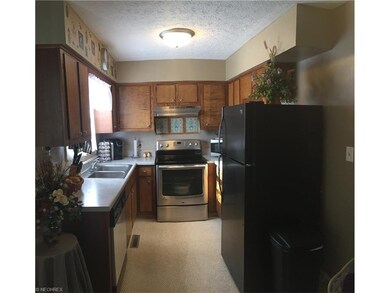 Kithcen features numerous cabinets for storage and