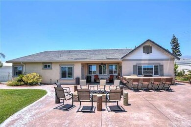 REAR VIEW SHOWING BBQ CENTER AND FIRE PIT