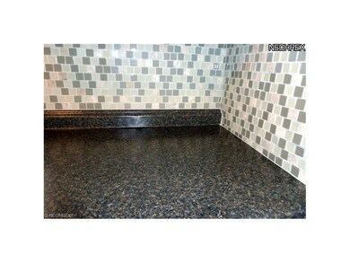 Granite-Look Counters and Glass Mosaic