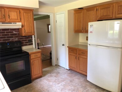 Coffee nook next to refrigerator. Another large pa