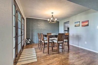 Dining room with French doors to the covered deck.