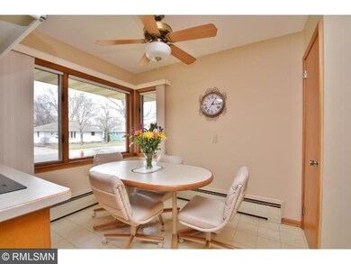 Large eat in dining area with bright windows and p