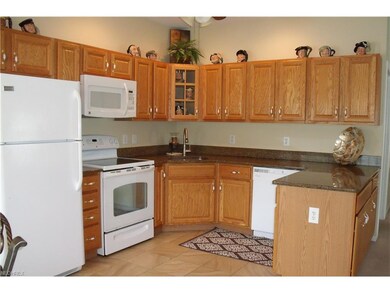 Kitchen with granite counters, ceramic floor, beau