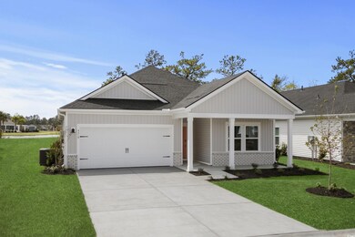 View of front of home with driveway, a front yard,