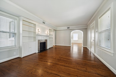 Another view of living room with the kitchen and d