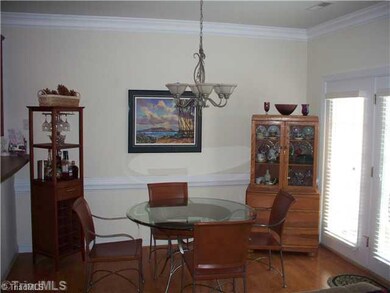Breakfast. Breakfast room with hardwood floors and crown molding and chairrail