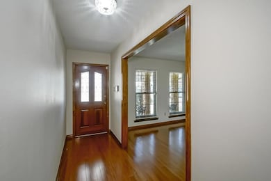 Nice entry foyer with wood floors.