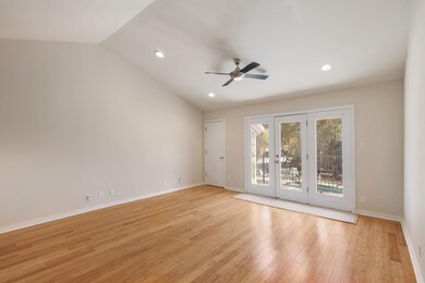 Unfurnished room with vaulted ceiling, recessed l