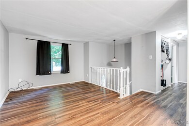 Spare room featuring wood-type flooring