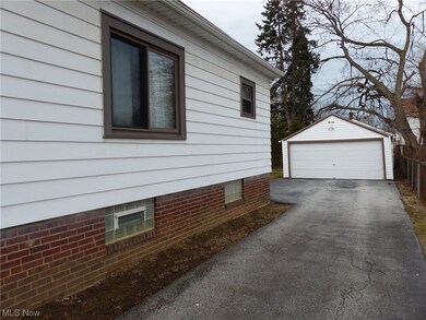 View of side of home featuring a garage