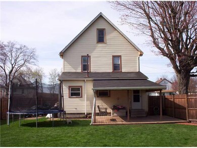 Exterior Back. Inviting covered  porch for relaxin