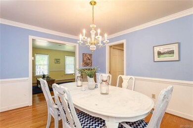 Dining room featuring crown molding, chair rail.