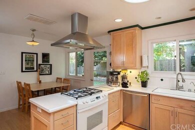 The sleek suspended stove hood complements the sta