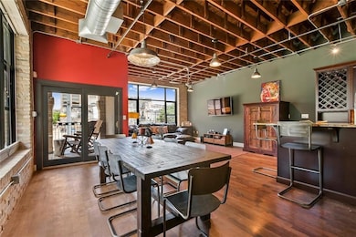 Dining area with track lighting, wood finished fl