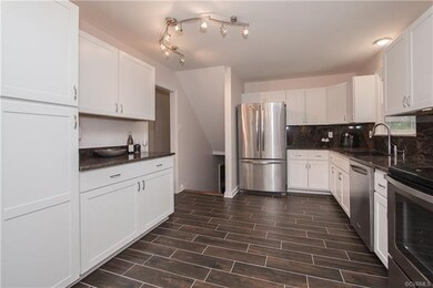 Spacious kitchen with new tile floor