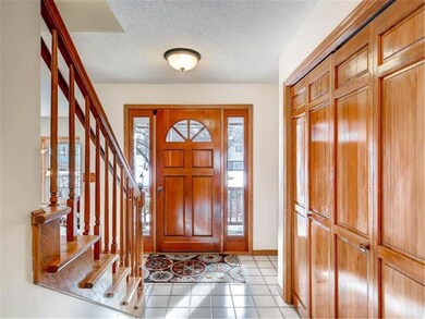 Beautiful and bright tiled entry showcasing solid 