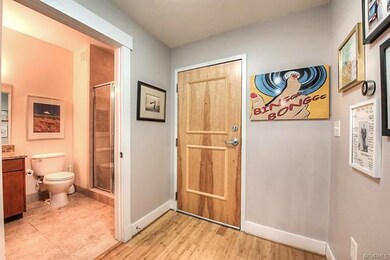Entry way to condo, with full guest bath and Nest 