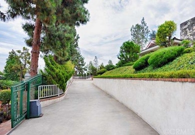 The long driveway leads to a 3-car detached garage