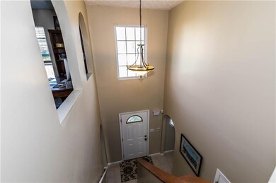 The foyer offers a Palladium window, new chandelie