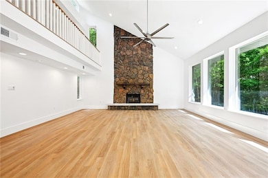 View from dining area, Den with wood burning firep