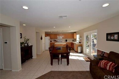 Looking into the dining area and kitchen from the 