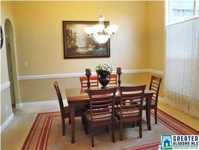 Spacious dining room with tray ceiling, large wind