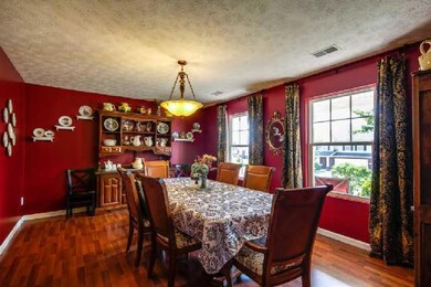 Enjoy your holiday feast with th everyone sitting at this large table in such a spacious dining room. Can you smell the turkey?