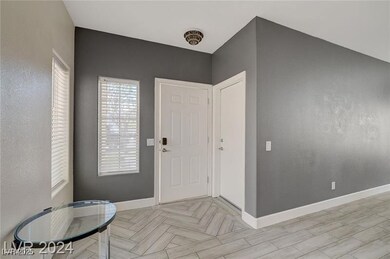 Foyer entrance featuring baseboards