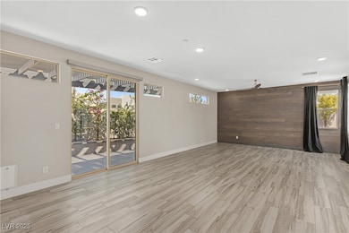 Empty room featuring light wood-type flooring, rec