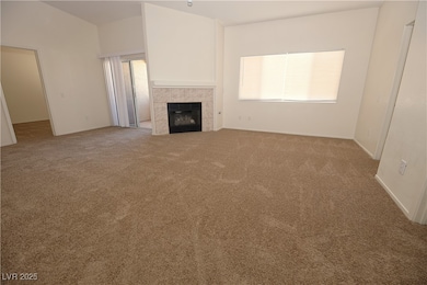 Unfurnished living room featuring carpet floors an