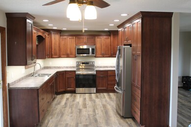 Cabinets, LG appliances, window, lighting and flooring
