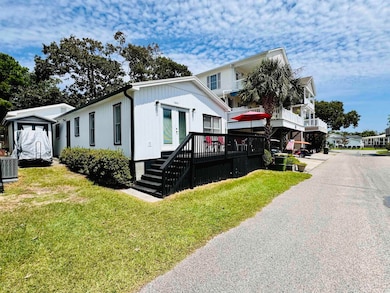 Exterior space with a balcony and a front yard