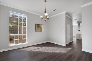 dining area with a notable chandelier, dark hardwo